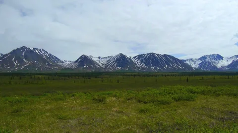 Pan Left, Mountain Range with Green Field Stock Footage 37398211