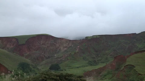 Pan left of mountainous terrain Stock Footage 310541309