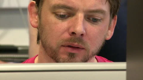 Pan Left to Office Worker Front on at Computer Stock Footage 58241700