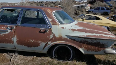 Pan Left Old Car Junk Yard Video stock 106414749