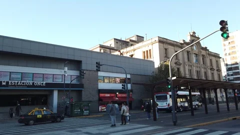 Pan Left at Once Railway Station with City Bus Reflecting Buenos Aires Urban Stock Footage 342296562
