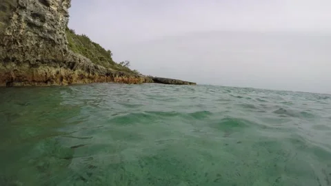 Pan left of outside of underwater cave opening Stock Footage 160809593