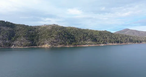 Pan left over lake and mountains Stock Footage 329902305