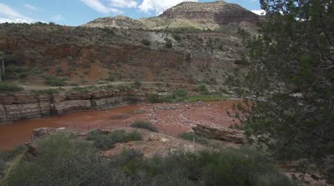 Pan Left Over Muddy River Stock Footage 51677362