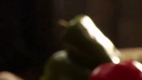 Pan from left over peppers to grab a pinch of salt Stock Footage 102717429