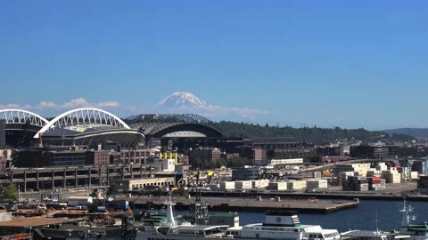 Pan to left over Seattle waterfront with Mount Rainier in background Stock Footage 143471300