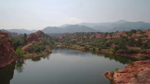 Pan Left Red Rocks on Water 스톡 동영상 84957011