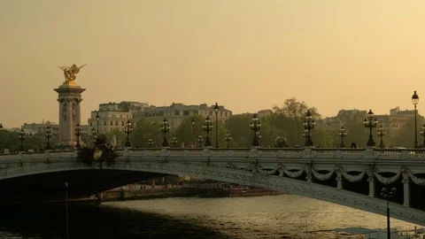 Pan from left to right across Alexandre III bridge during sunset in Paris Stock Footage 113188015