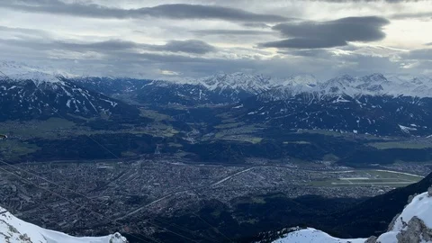 Pan left to right in the alps over Innsbruck Stock Footage 126013850