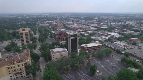 Pan left to right around highrise in downtown fort collins Video stock 157735879