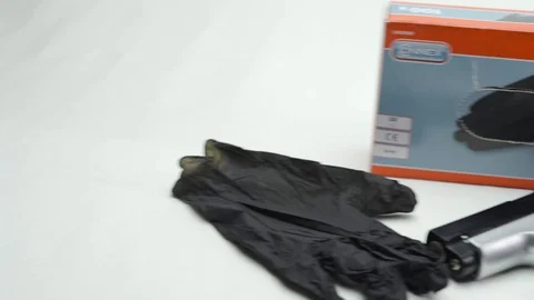 Pan From Left To Right Disposable Gloves And Gun Stock Footage 126015025