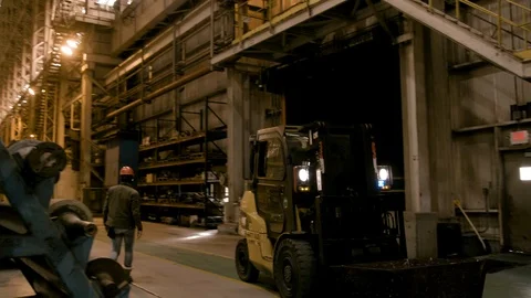 Pan Left to Right as Forklift Passes in Modern Factory Stock Footage 89944493