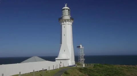 Pan left to right of lighthouse to ocean & fauna Green Cape NSW Australia Stock Footage