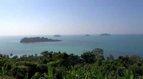 Pan left to right over some misty tropical islands - 4 Stock Footage 36008120