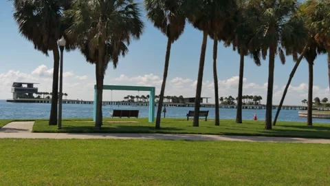Pan left to right Pier to downtown  Luxury Marina With Yachts and Historic Vinoy Stock Footage 314622636