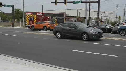 Pan left to right. Three Vehicle accident on Main Road with Emergency Vehicles I Stock Footage 310027630