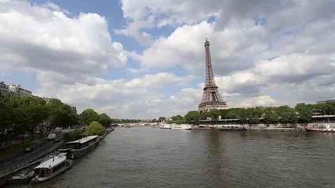 Pan left to right view of the Eiffel tower close to the Seine river in Paris Stock Footage 74151379