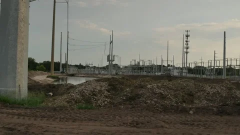 Pan left to right Wide view near sunset of Electric Substation with High Power L Stock Footage 281992349