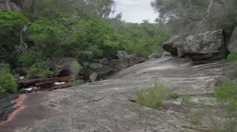 Pan left of rocky formations at Genoa Creek, Victoria Australia WITH AUDIO 動画素材 11289728