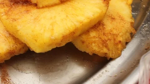Pan left shot from fresh strawberries to spiced pineapple slices and raw bar Stock Footage 340534124