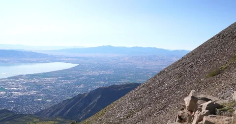 A pan to the left from the top of Mount Timpanogos on a clear sunny day Stock Footage 120149526