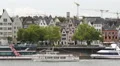 Pan Left Tour Boat Passing Cologne Skyline Old Town Cityscape Rhine River People HD Footage