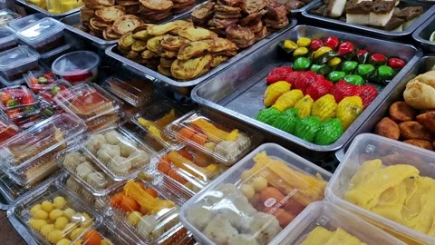 Pan left of various types of Malay dishes (kueh muih) during ramadan month 스톡 동영상 330108490