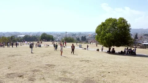 Pan left view of park with cityscape in Cholula Puebla Mexico Vídeos de archivo 331929613