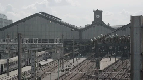 Pan Left Wide Shot of Train Track At Gare Saint Lazare in Paris With Trains Stock Footage 107700620