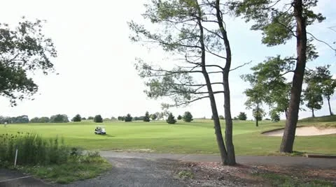 Pan Left WS of Golf Course with Golfers 스톡 동영상 11884436