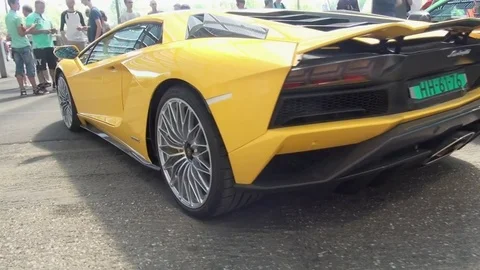 Pan to the left on Yellow Lamborghini Stock Footage 81228548