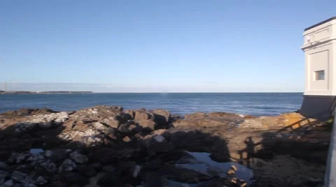 Pan to Lighthouse on Ocean Stock Footage 48622822