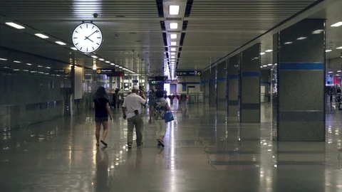 Pan of lights in underground metro station to people walking Stock Footage 81530776