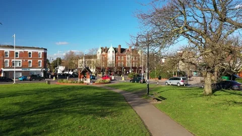 PAN LOW ANGLE ROTATION CITY PARK REVEAL AERIAL Stock-Footage 149857885