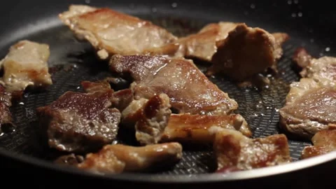 The pan with meat rotates clockwise Stock Footage 133250187