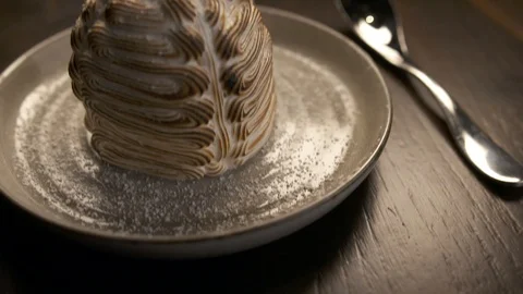 Pan up of meringue with spoon  Stock Footage 112660481