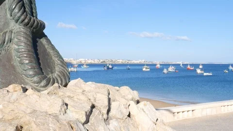 Pan up of a mermaid statue supposed to keep watch over Cascais' fishermen until Stock Footage 108489788