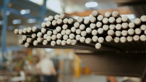 Pan motion close-up of metal bars in a factory or foundry Stock Footage 115826848