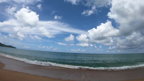 Pan motion of white cloud and blue sky on Mai Khao beach Phuket Stock-Footage 153042148