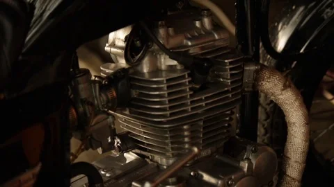 Pan up of motorcycle engine and handle bars Stock Footage 72713143