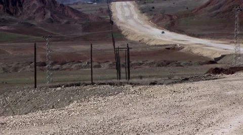 Pan up from mountain road under construction, Eastern Turkey.mp4 Stock Footage 61397564