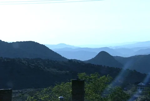 Pan of Mountains Lens Flare Video stock 97775683