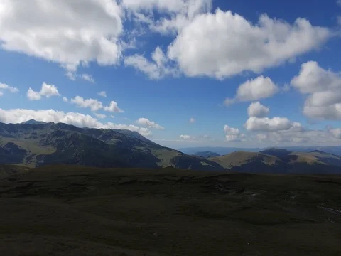 Pan of mountanous landscape with fluffy clouds in the Carpathian Mountains 4k Video stock 79057570