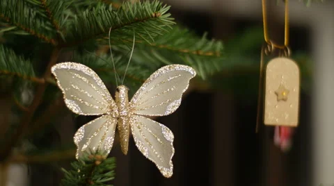 Pan movement while  decorating Christmas tree with Santa`s sledge Stock Footage 47063884