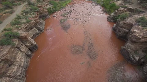 Pan Up from Muddy River Stock Footage 51677458