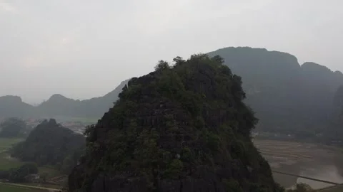 Pan Up Narrow Mountain Vietnam Stock Footage 255030701