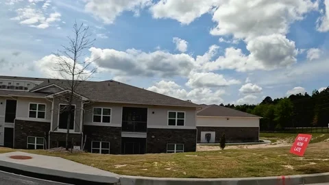 Pan of new  Apartment complex buildings Rent is late sign Horizon Ridge Stock Footage 179955550
