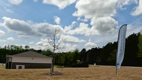 Pan of new  Apartment complex buildings balloons and signs Stock Footage 179956033