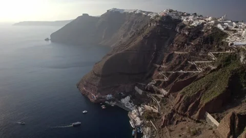 Pan up to ocean and cliffside architecture 4K Stock Footage 314753959