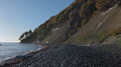 Pan From Ocean With Sunset To Beach With Cliff Stock Footage 37208454